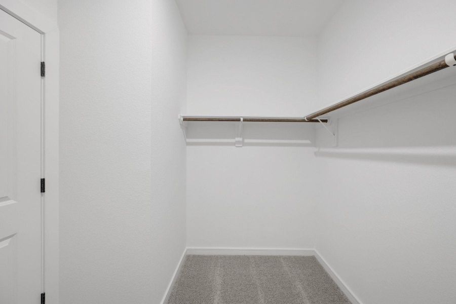 Primary walk-in closet Primary walk-in closet