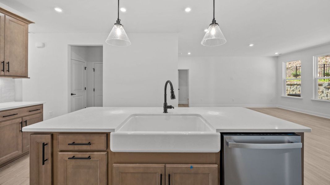 The Fairfield by DRB Homes in Farms at Bellingham Mooresville NC - Kitchen with Custom Farmhouse Sink