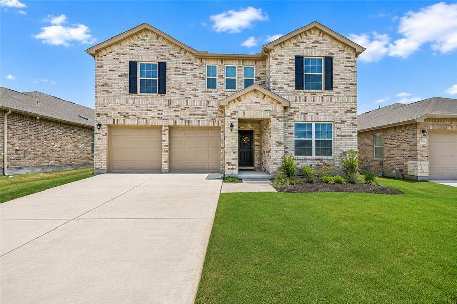 Front exterior of a new home in , Denton, TX, highlighting curb appeal (Image 2). Front exterior of a new home in , Denton, TX, highlighting curb appeal (Image 2).