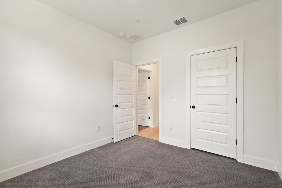 Spacious, unfurnished interior of a new home in Koenig Townhomes, Austin (Image 15).