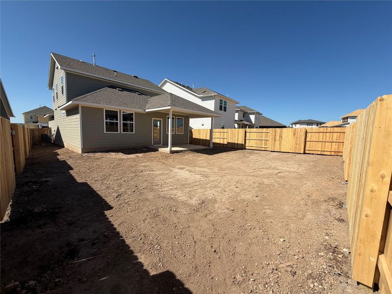 Exterior details and patio area of a home in Lariat, Liberty Hill (Image 14).