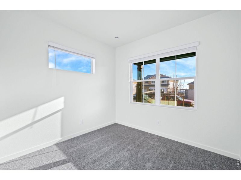 Spacious, unfurnished interior of a new home in Union Colony West, Greeley (Image 12).