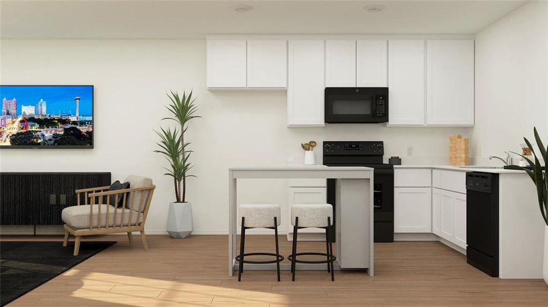 Kitchen with black appliances, white cabinetry, sink, and light hardwood / wood-style floors