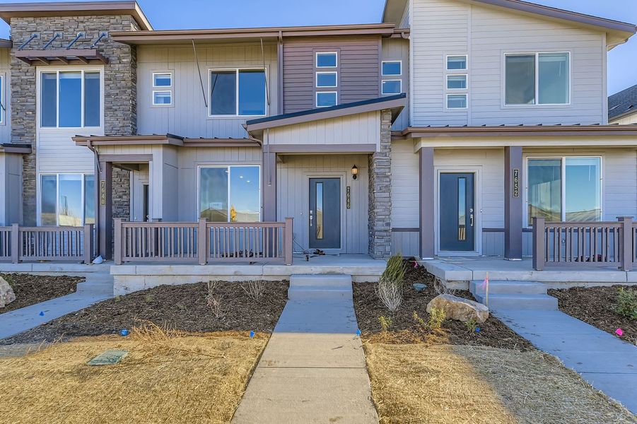 Front exterior of a new home in Vermilion Creek: The Parkside Collection, Centennial, CO, highlighting curb appeal (Image 1).