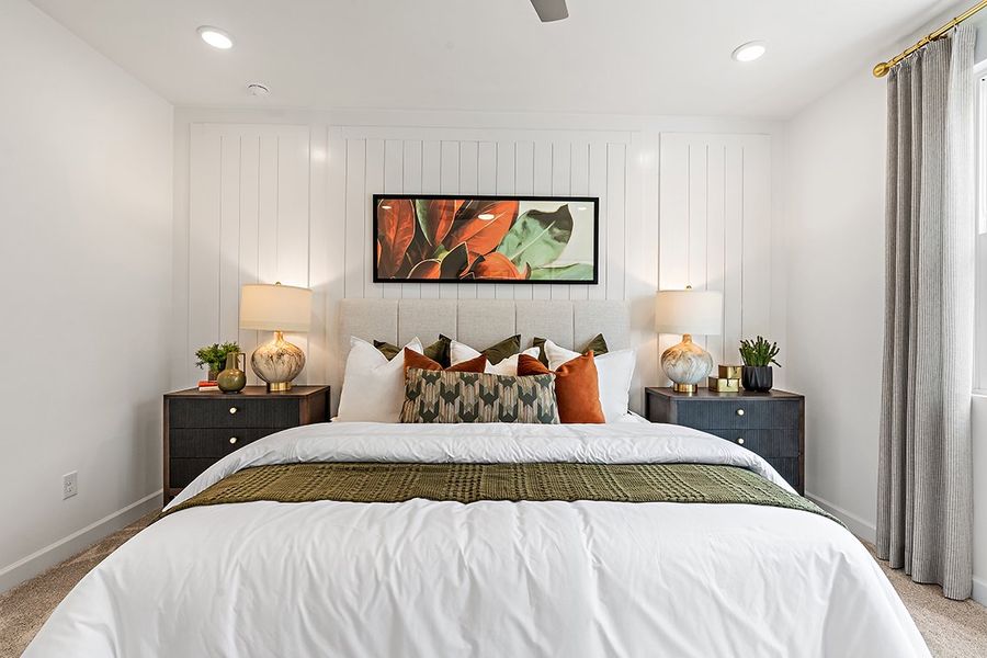 A bedroom with a large bed. A bedroom with a large bed.