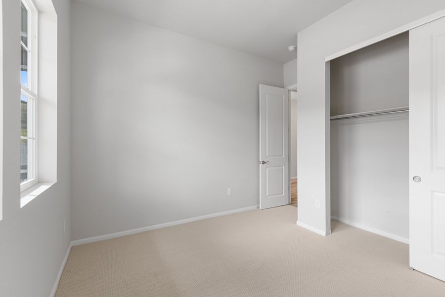 Spacious, unfurnished interior of a new home in The Manors Collection at Golden Overlook, Lakewood (Image 15).