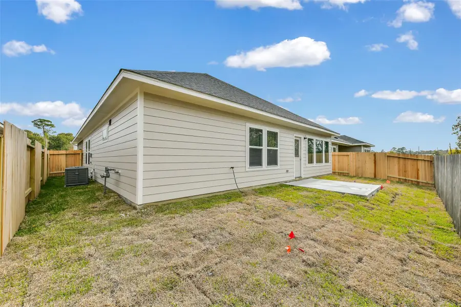 Exterior details and patio area of a home in King Oaks Village, Baytown (Image 4).