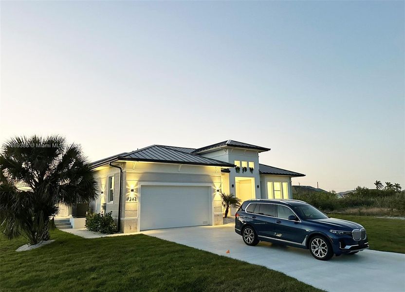 Front exterior of a new home in , Port Charlotte, FL, highlighting curb appeal (Image 1).