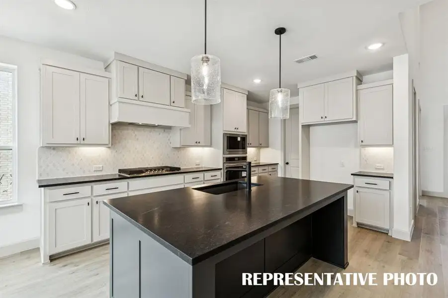 Featuring outstanding space, storage and style, this dream kitchen has it all!  REPRESENTATIVE PHOTO