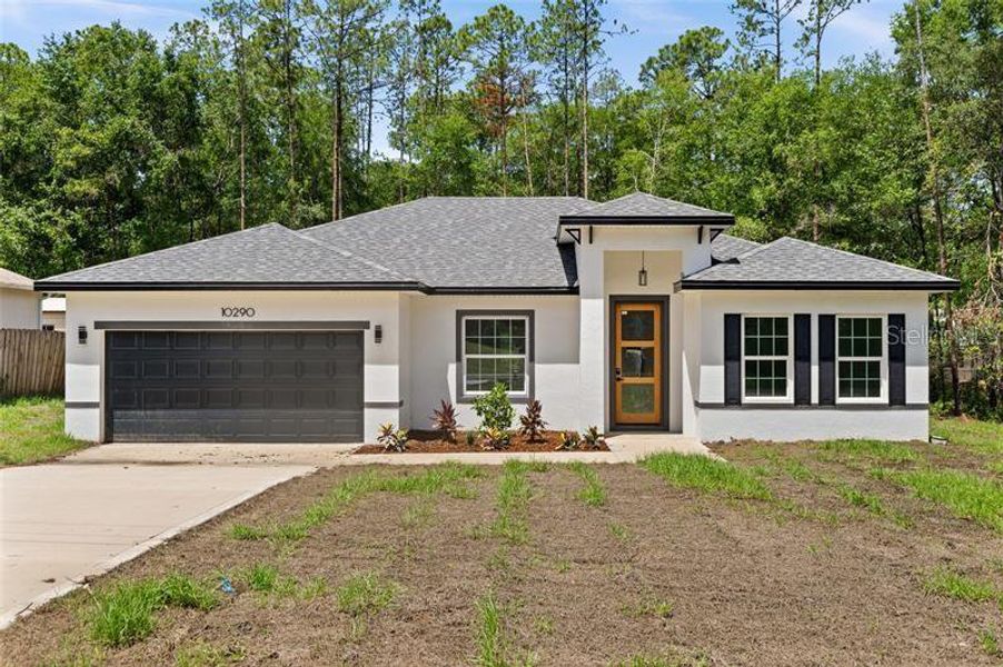 Front exterior of a new home in , Citrus Springs, FL, highlighting curb appeal (Image 1). Front exterior of a new home in , Citrus Springs, FL, highlighting curb appeal (Image 1).