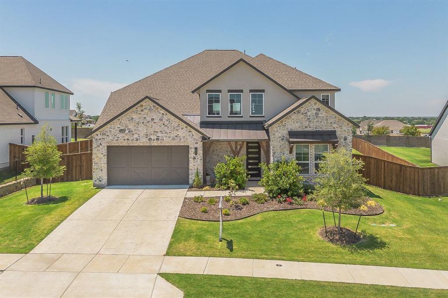Front exterior of a new home in Sweetgrass, Haslet, TX, highlighting curb appeal (Image 20).