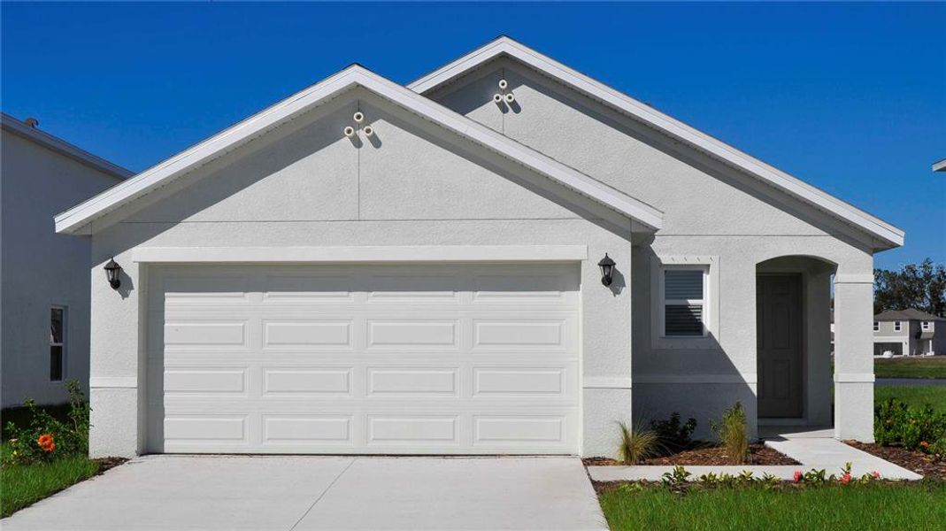 Front exterior of a new home in Oakfield Lakes, Parrish, FL, highlighting curb appeal (Image 2).