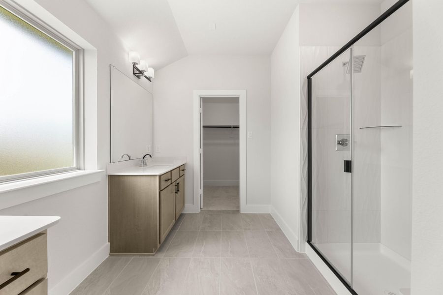 Representative furnished interior of a home built from the Magnolia by Tri Pointe Homes in Treeline, Justin (Image 11).