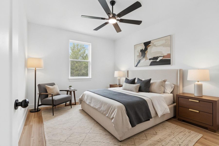 Virtually staged Secondary Bedroom featuring light wood finished floors and ceiling fan