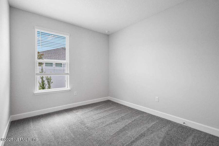 Spacious, unfurnished interior of a new home in Colbert Landings, Palm Coast (Image 23).