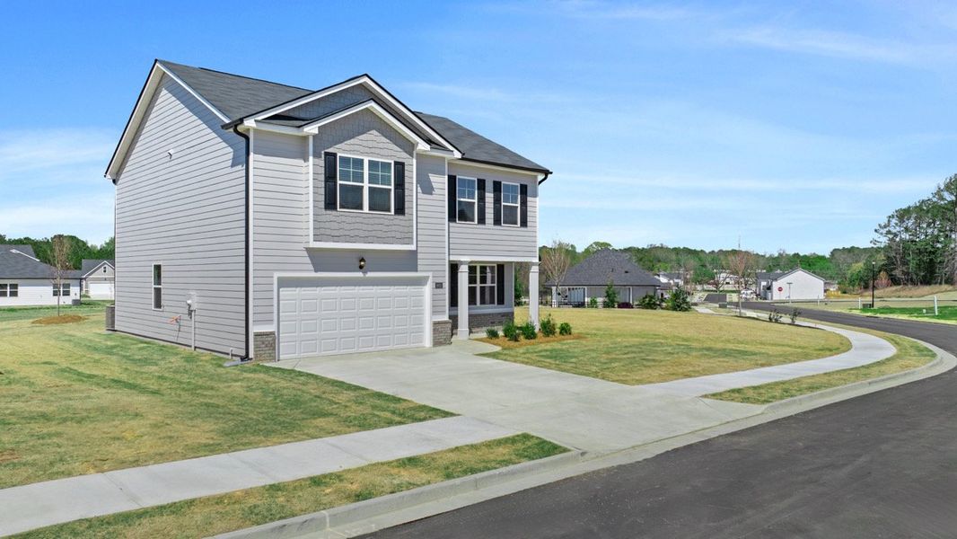 Front exterior of a new home in Champion's Run, Lithonia, GA, highlighting curb appeal (Image 1). Front exterior of a new home in Champion's Run, Lithonia, GA, highlighting curb appeal (Image 1).