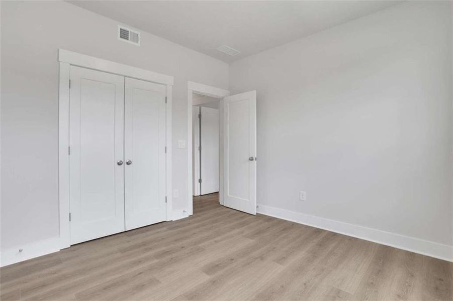 Spacious, unfurnished interior of a new home in The Paddocks at Doc Hughes, Buford (Image 27).