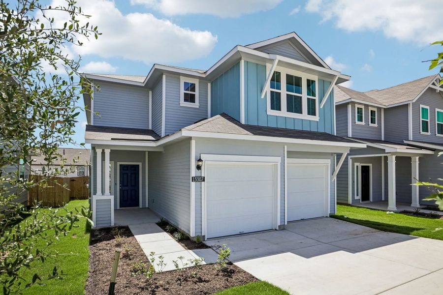 Front exterior of a new home in Edgebrooke, Pflugerville, TX, highlighting curb appeal (Image 2). Front exterior of a new home in Edgebrooke, Pflugerville, TX, highlighting curb appeal (Image 2).