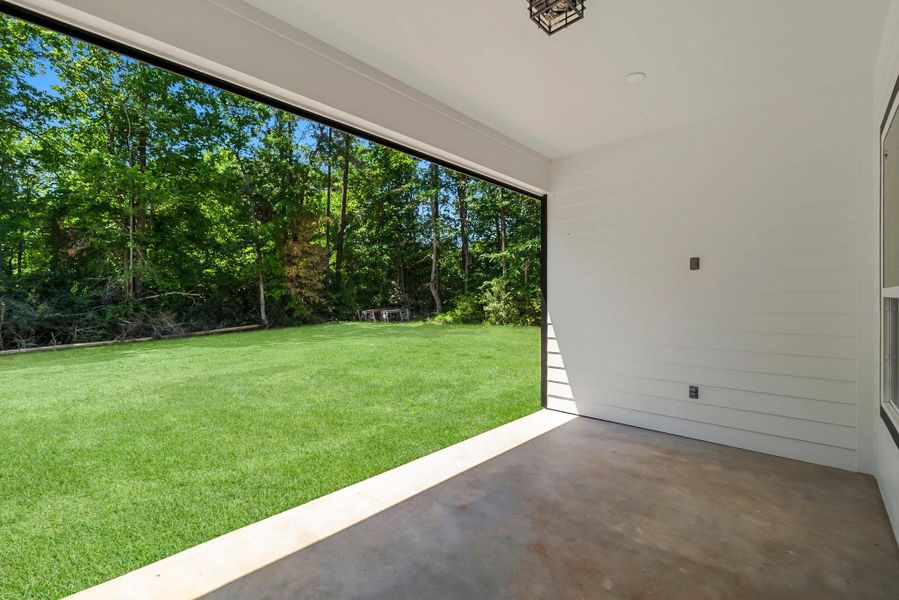 Grass digitally enhanced.  Boundary goes beyond trees in the back. Trees in the back were left as a privacy barrier but can be cut down.