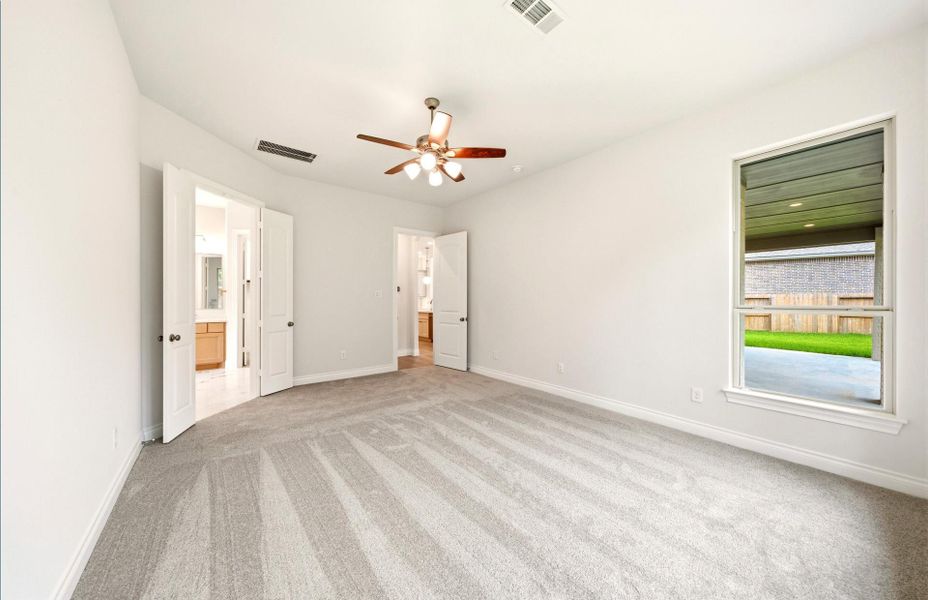 Spacious, unfurnished interior of a new home in The Woodlands Hills 65′, Willis (Image 32).