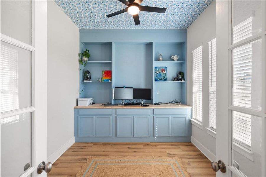 Office featuring light wood-type flooring and a ceiling fan