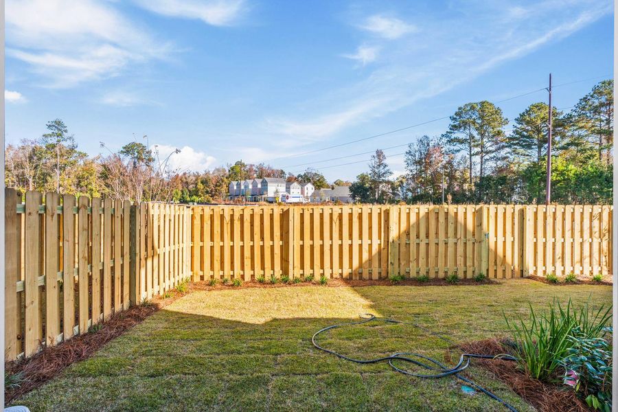 Exterior details and patio area of a home in , Johns Island (Image 33).