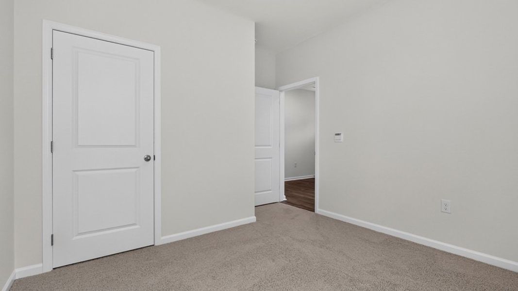 Spacious, unfurnished interior of a new home in The Grove at Matthews Landing, Fuquay Varina (Image 24).