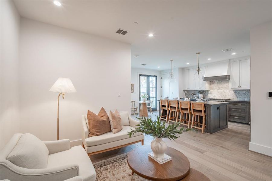 Living room with light wood-type flooring