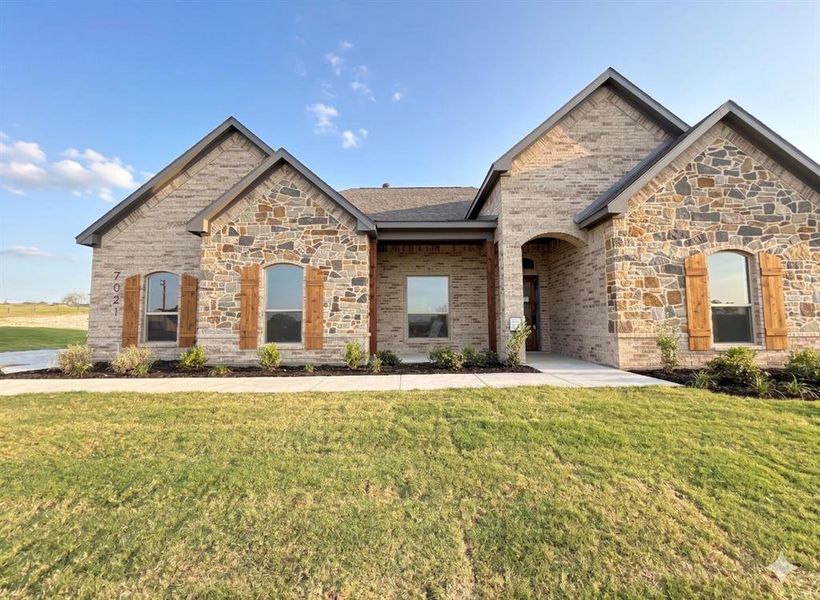 Front exterior of a new home in The Ranches At Valley View, Springtown, TX, highlighting curb appeal (Image 16).