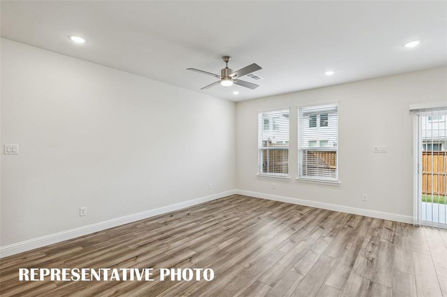 The entire family will enjoy this light filled family room.  REPRESENTATIVE PHOTO