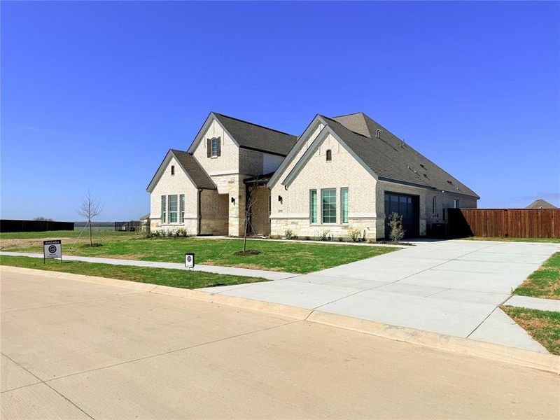 Front exterior of a new home in Polo Ridge, Forney, TX, highlighting curb appeal (Image 15).