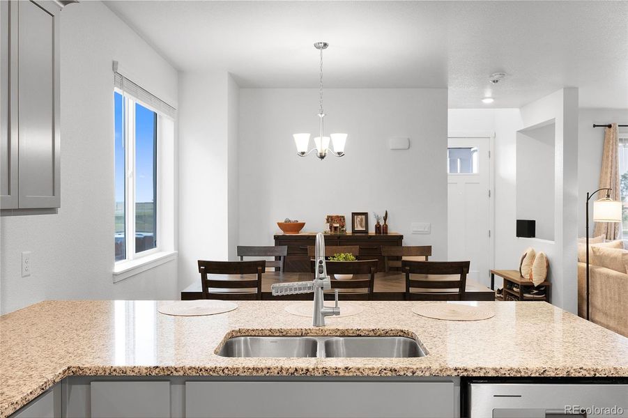 Kitchen & dining room have abundant light and nice flow to the family room.