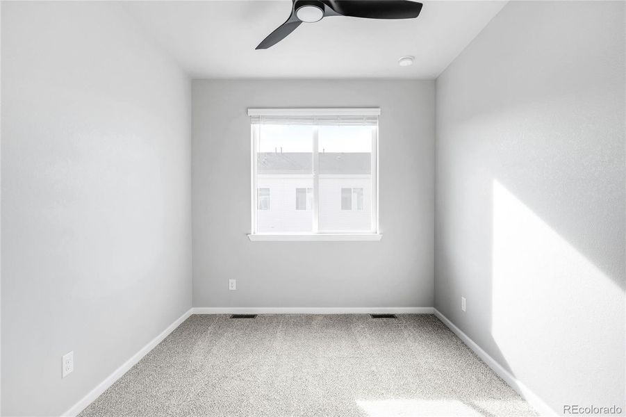Each of the two secondary bedrooms has a closet, window treatments, freshly cleaned carpets and a ceiling fan