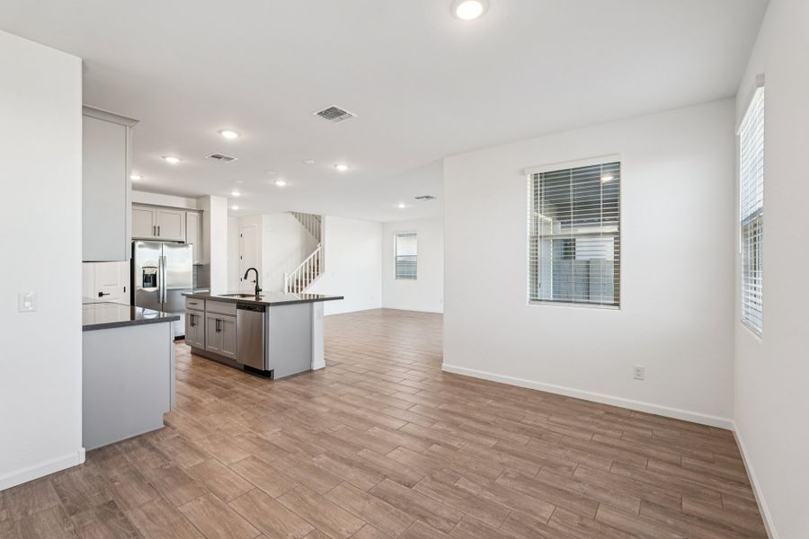 Dining into kitchen and great room. Finishes and options may vary.