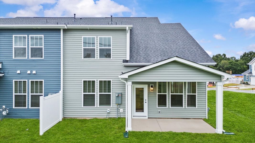 Notable exterior includes a rear covered porch designed for year-round enjoyment at Silo Ridge by DRB Homes in Anderson, SC