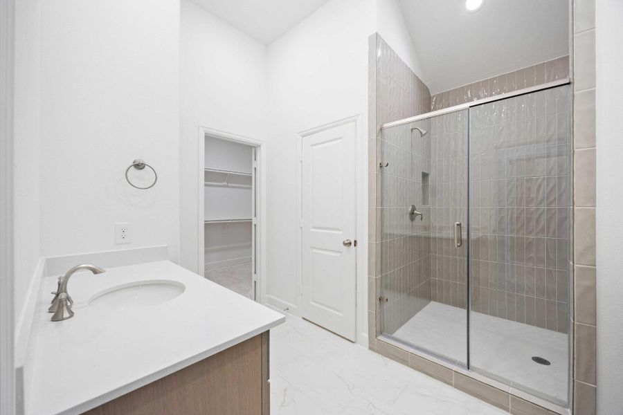 Primary shower built for a true reset — oversized with dual showerheads for a spa-style experience.