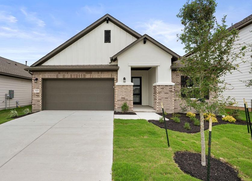 Front exterior of a new home in Lagos Reserve, Manor, TX, highlighting curb appeal (Image 1). Front exterior of a new home in Lagos Reserve, Manor, TX, highlighting curb appeal (Image 1).
