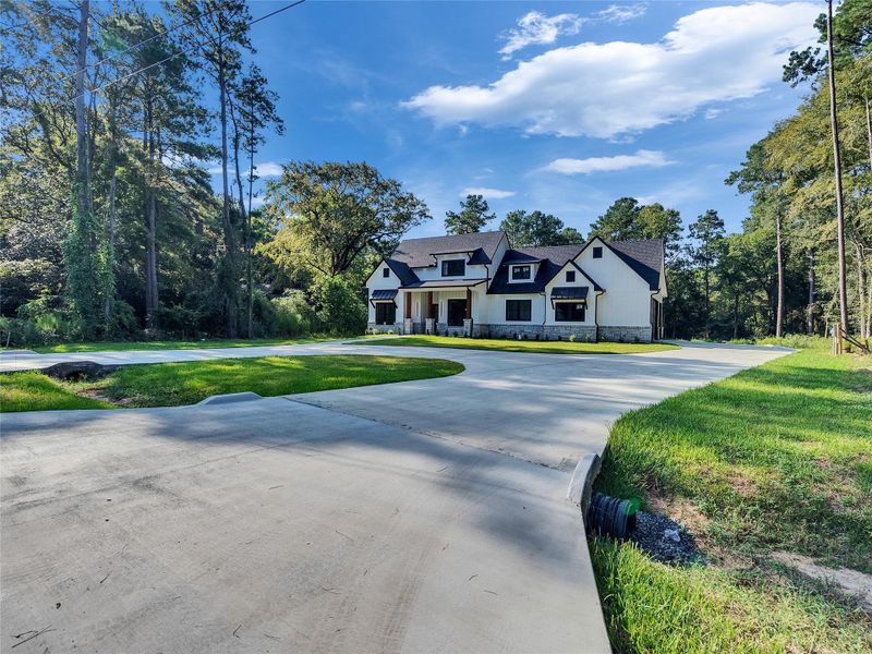 Front exterior of a new home in , Magnolia, TX, highlighting curb appeal (Image 30).