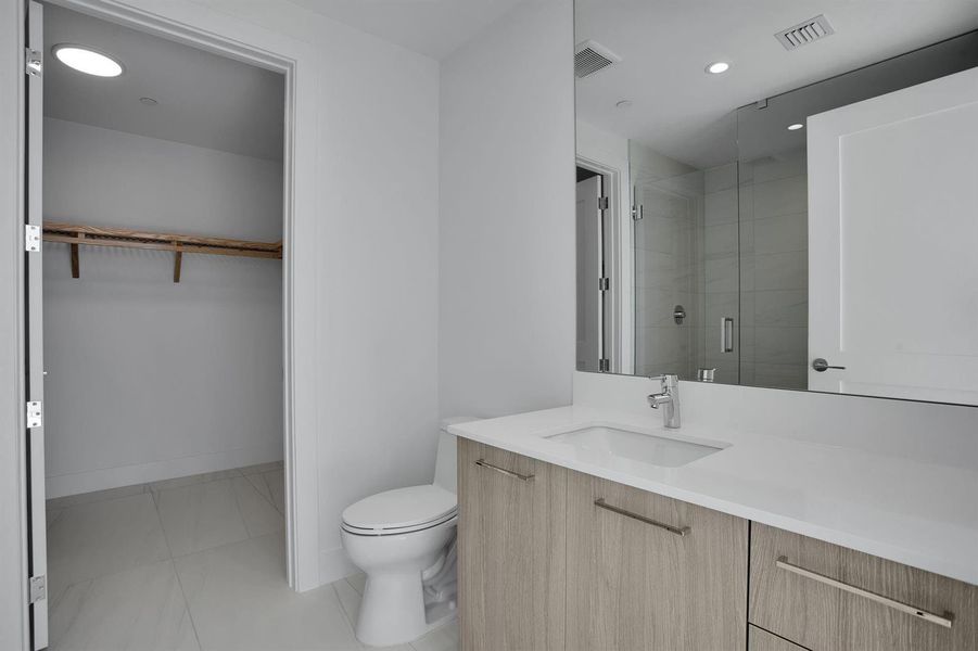 Guest Suite Walk-In Closet and Bathroom Guest Suite Walk-In Closet and Bathroom