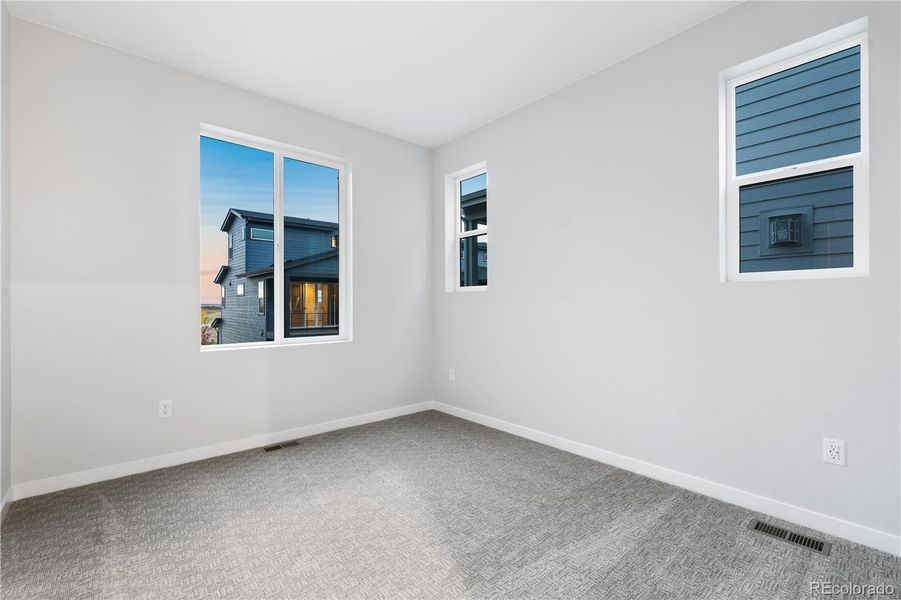 Spacious, unfurnished interior of a new home in Tribute at Lyric, Lone Tree (Image 29).