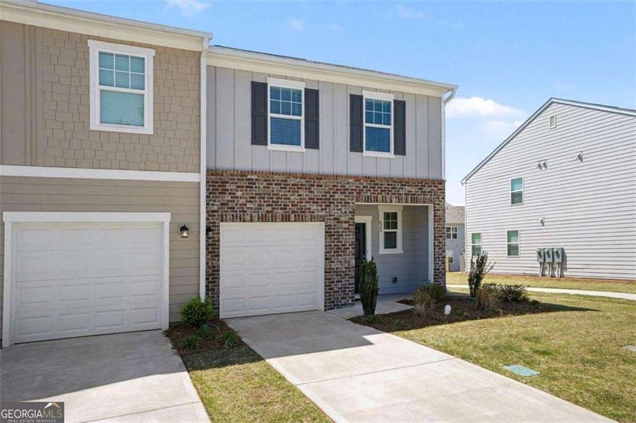 Front exterior of a new home in , Locust Grove, GA, highlighting curb appeal (Image 1). Front exterior of a new home in , Locust Grove, GA, highlighting curb appeal (Image 1).
