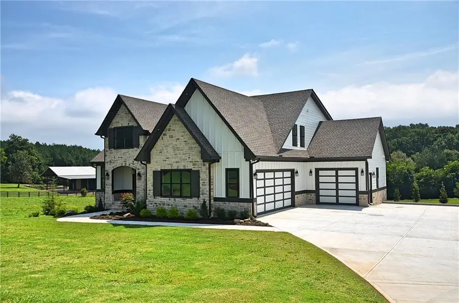 Front exterior of a new home in , Monroe, GA, highlighting curb appeal (Image 2). Front exterior of a new home in , Monroe, GA, highlighting curb appeal (Image 2).