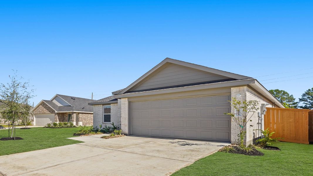 Front exterior of a new home in Cypress Green, Hockley, TX, highlighting curb appeal (Image 2).