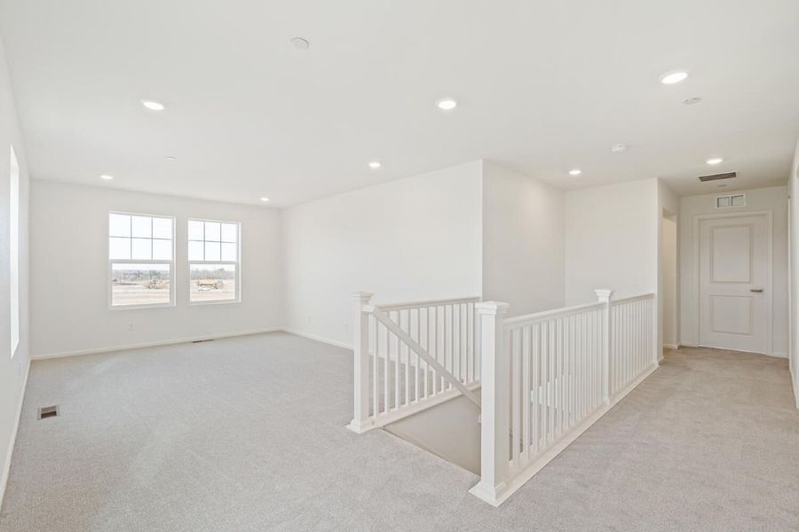 Spacious, unfurnished interior of a new home in The Nest Reserve at Canyon Creek, Erie (Image 15).