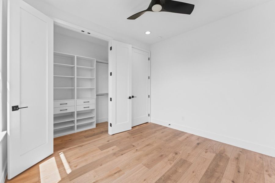 Built-in storage that grows with you, framed by clean, modern finishes.