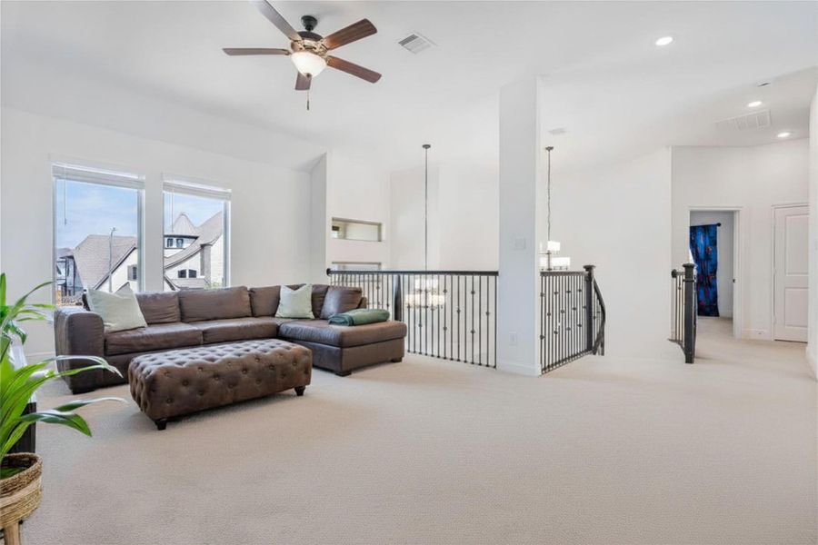 Spacious, sunlit upstairs game room featuring a versatile, open layout perfect for a pool table, entertainment