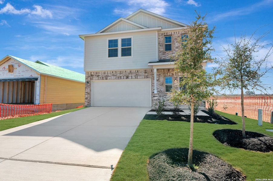 Front exterior of a new home in Winding Brook, San Antonio, TX, highlighting curb appeal (Image 27).