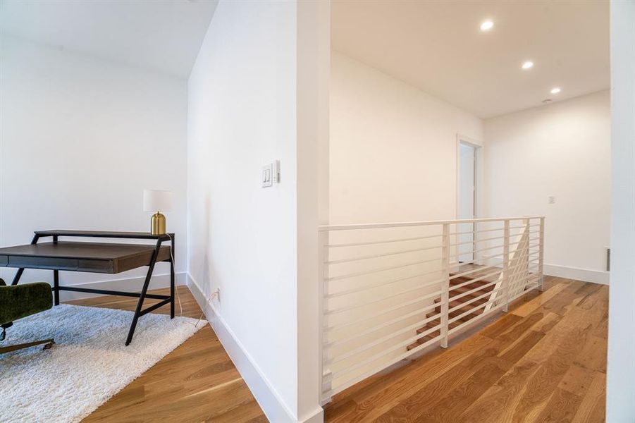 Hallway featuring wood-type flooring Hallway featuring wood-type flooring