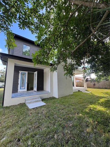 Front exterior of a new home in , Tampa, FL, highlighting curb appeal (Image 1).