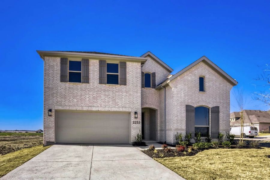 Front exterior of a new home in Meraki, Forney, TX, highlighting curb appeal (Image 20). Front exterior of a new home in Meraki, Forney, TX, highlighting curb appeal (Image 20).